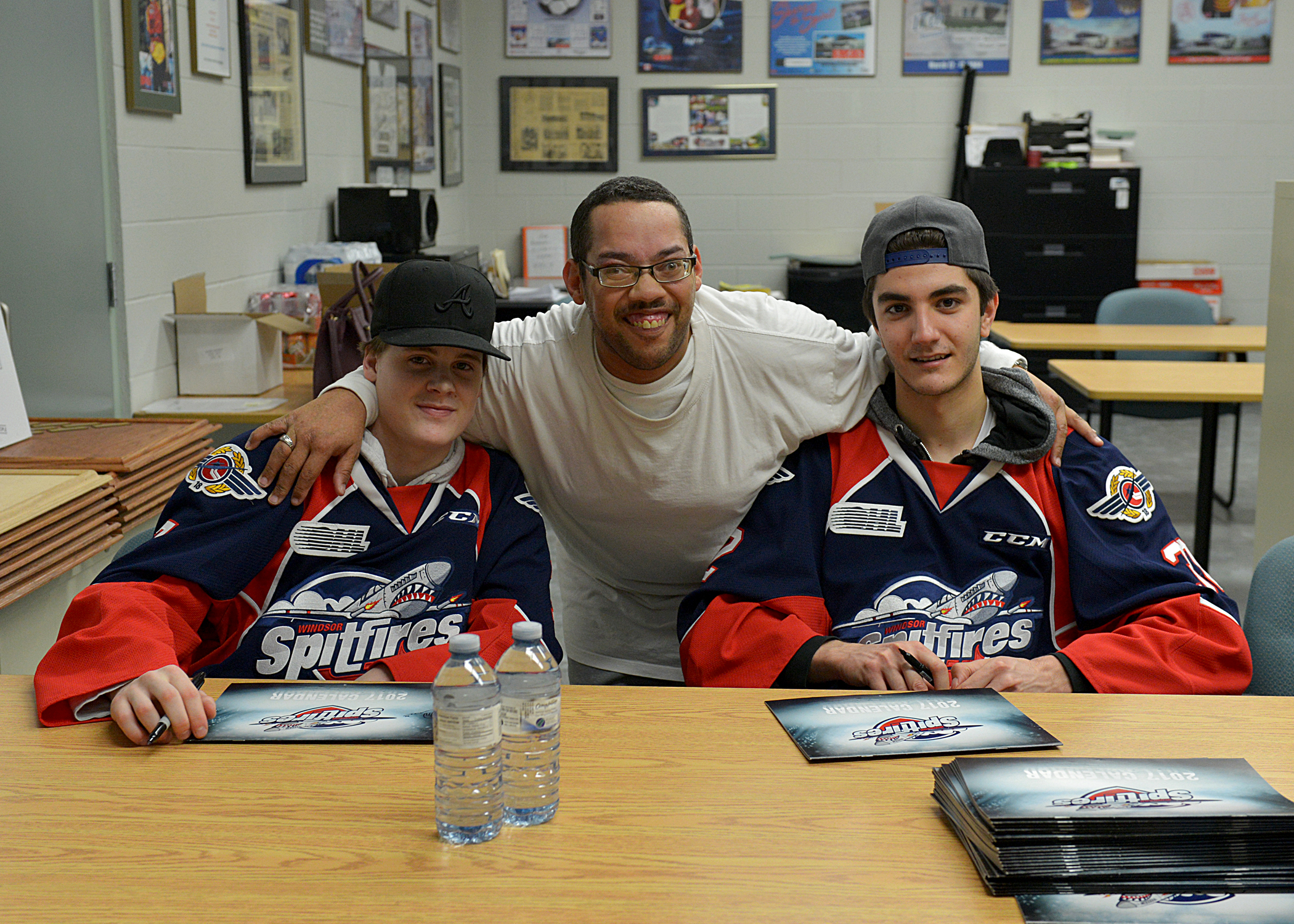 Theo Godden and Spitfires players in ICHA office
