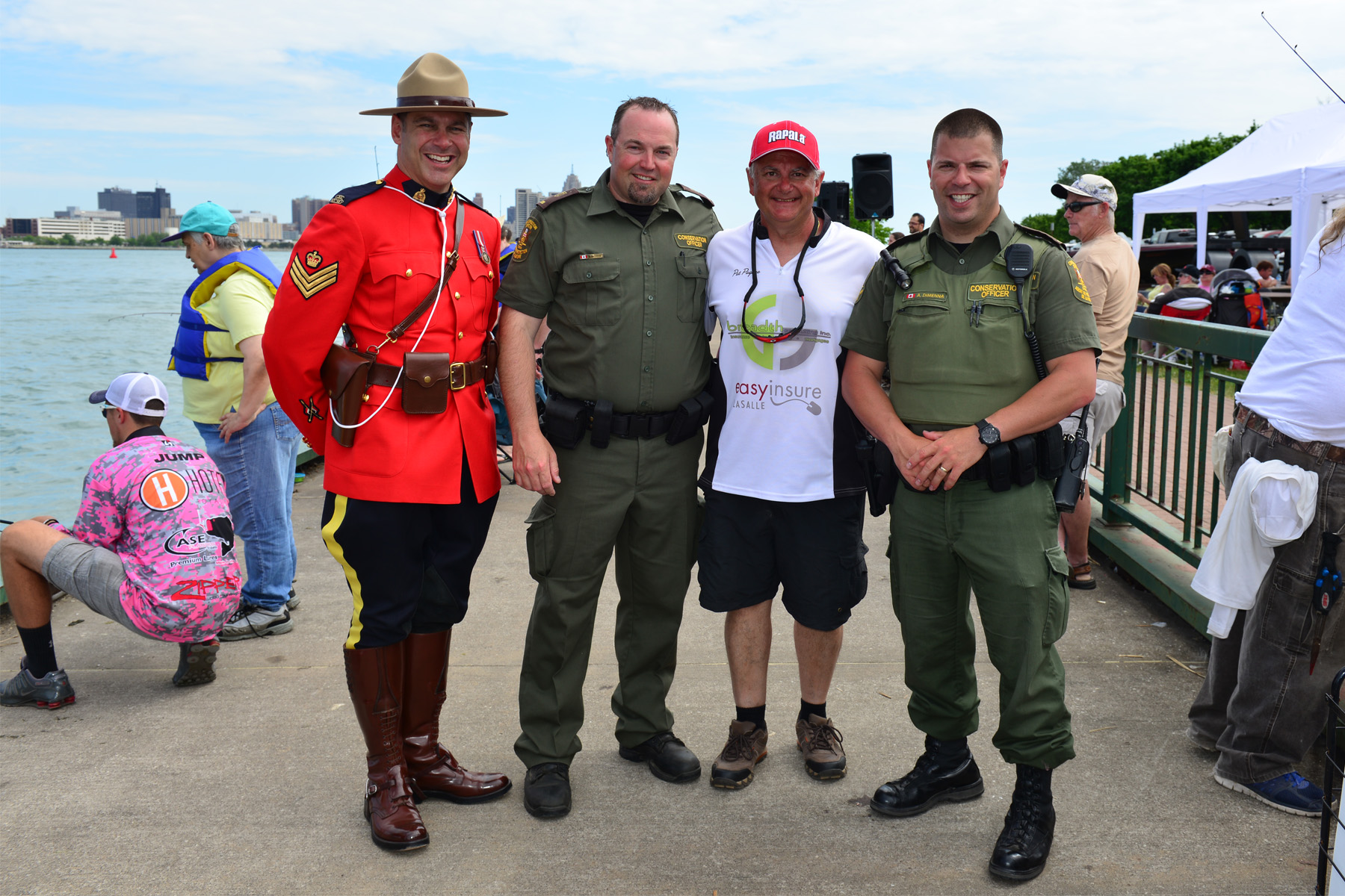 RCMP office Tim Debault stands with conservation officers