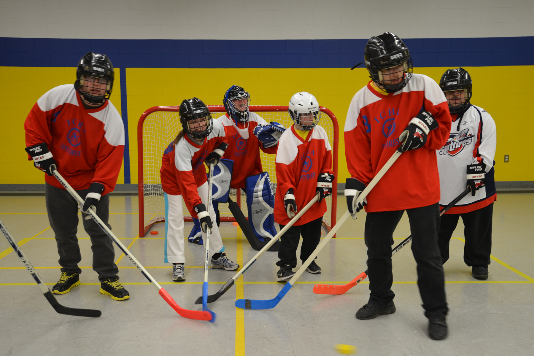ICHA Floor Hockey players lined up in front of the net