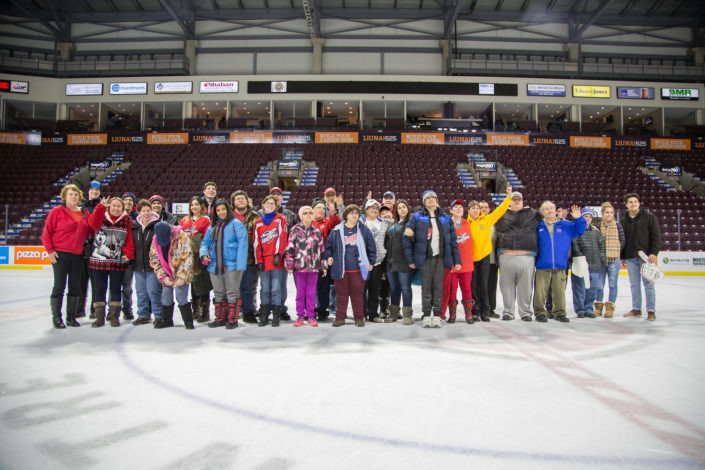ICHA members stand on the arena ice