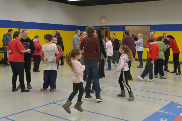 ICHA members and families dance at the Annual Valentine's Party